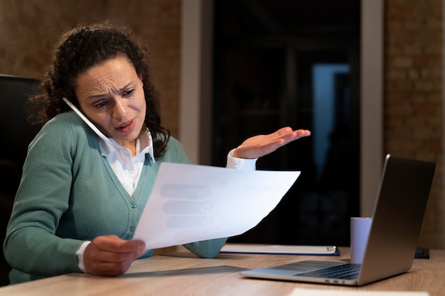 Tired woman working late for a deadline