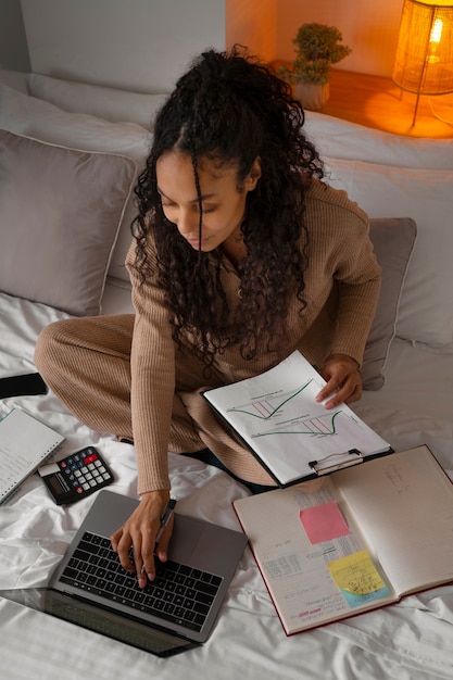 Full shot woman working as an economist